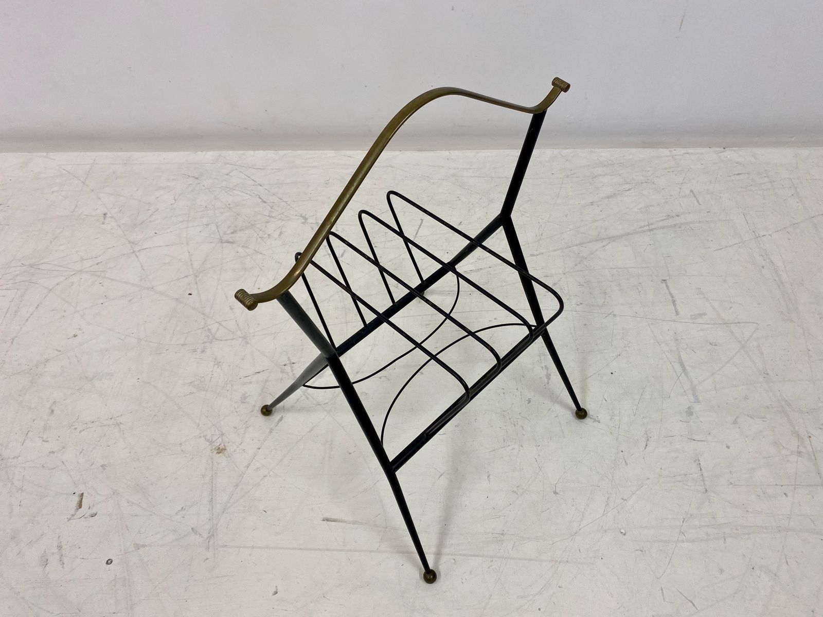 345.0 1960s Italian Black Metal And Brass Magazine Rack photo