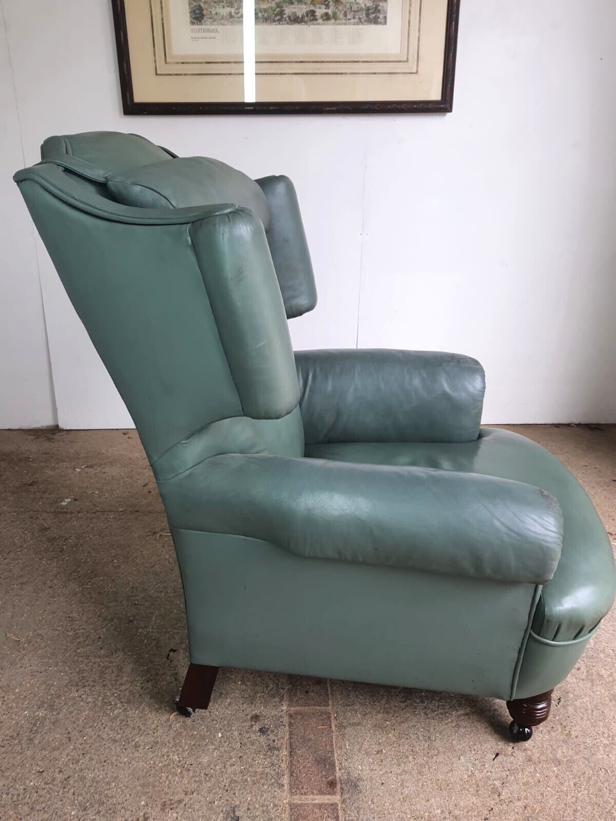 Antique Wing Back Green Leather Armchair Wood Legs Castors photo vinterior