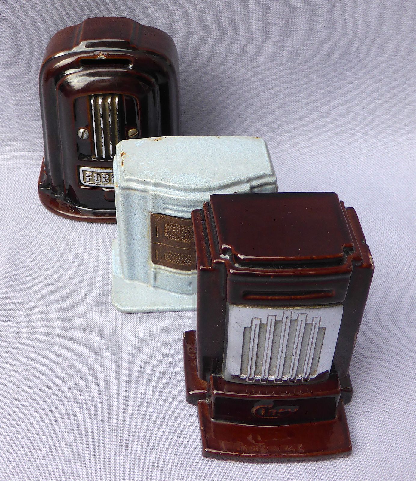 photo furniture Trio Of Cast Iron Cinay & Fobrux Stove Money Boxes