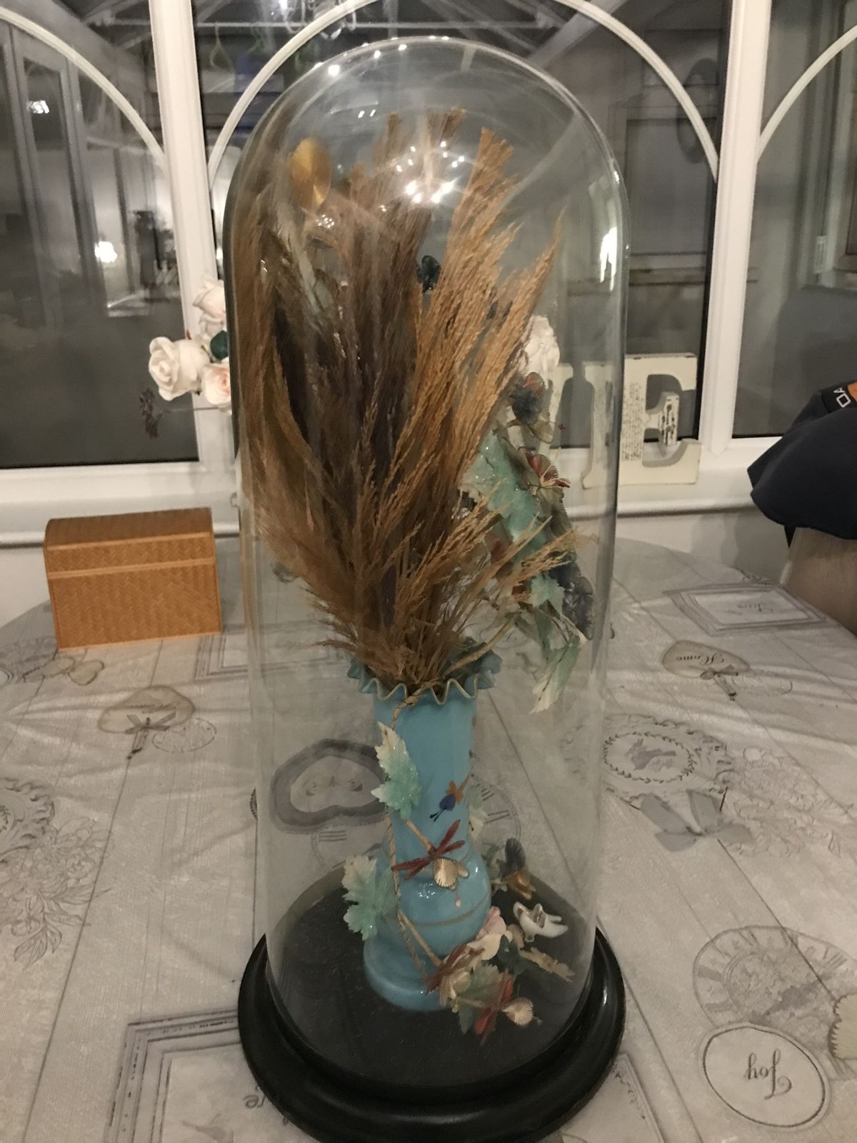 Tall Victorian Glass Dome Containing A Vase Of Silk Flowers . photo 150.0
