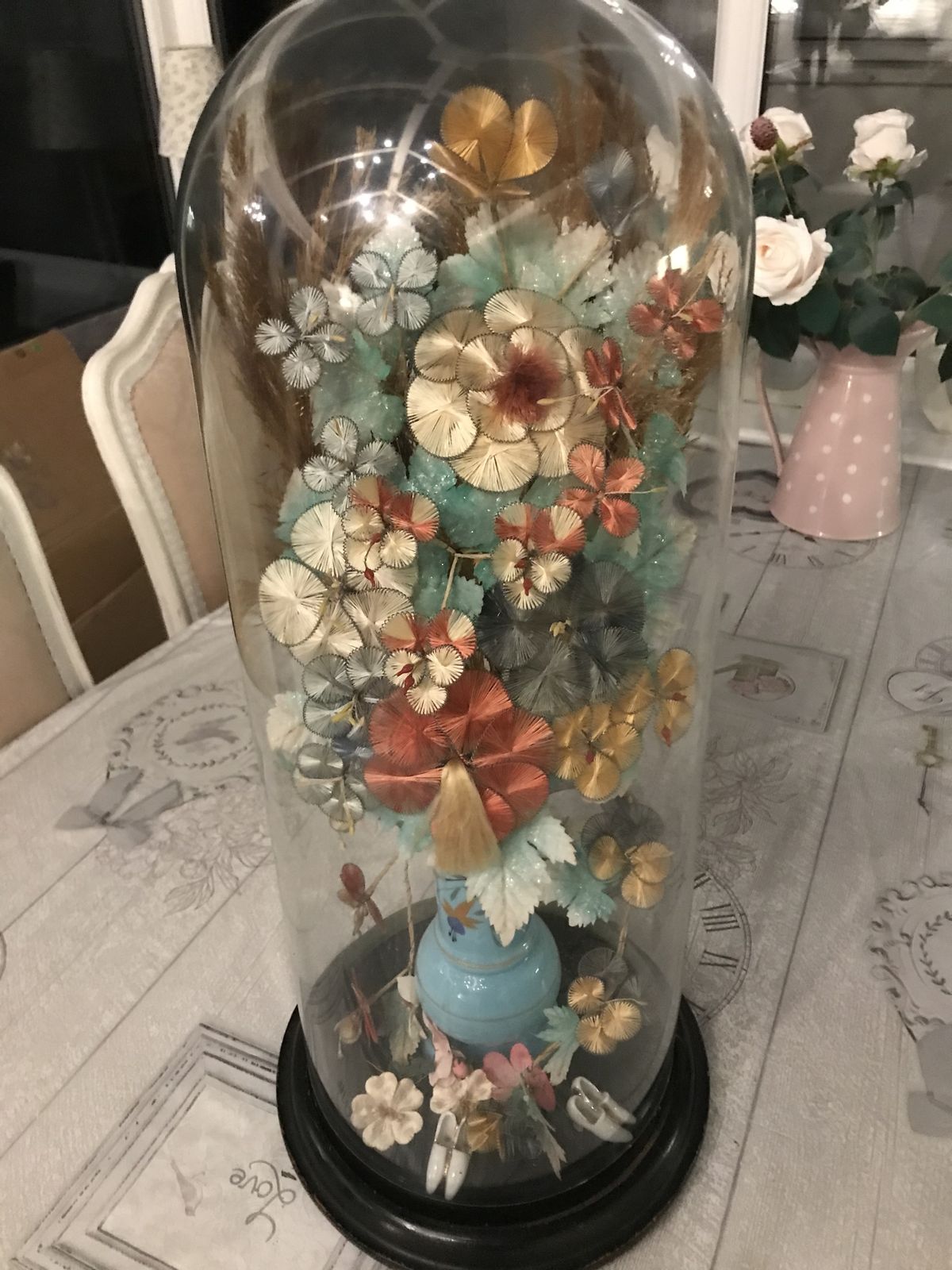 Tall Victorian Glass Dome Containing A Vase Of Silk Flowers .