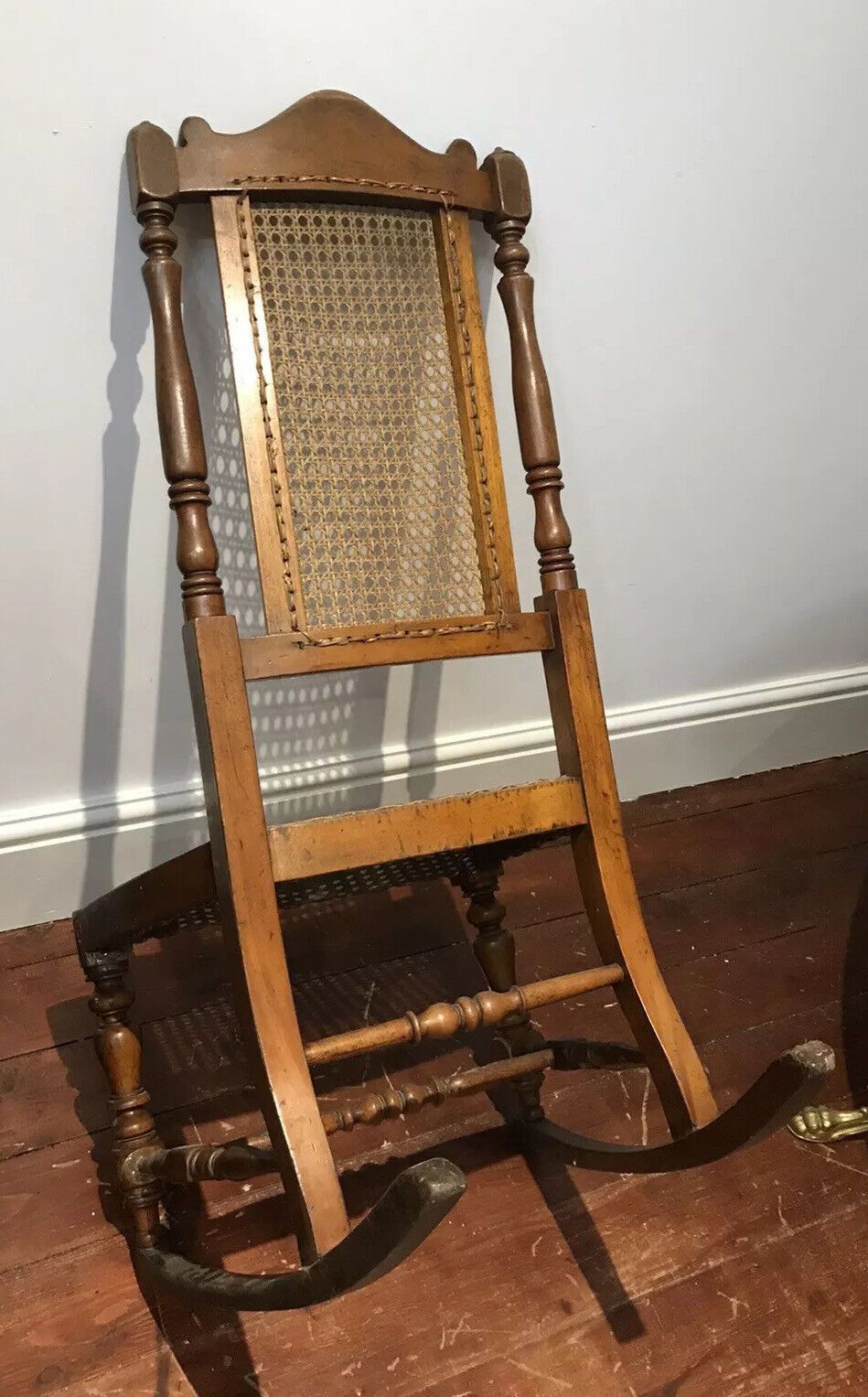 photo for sale Aesthetic Movement Rare Cane Serpentine Front Spindle Back Rocking Chair