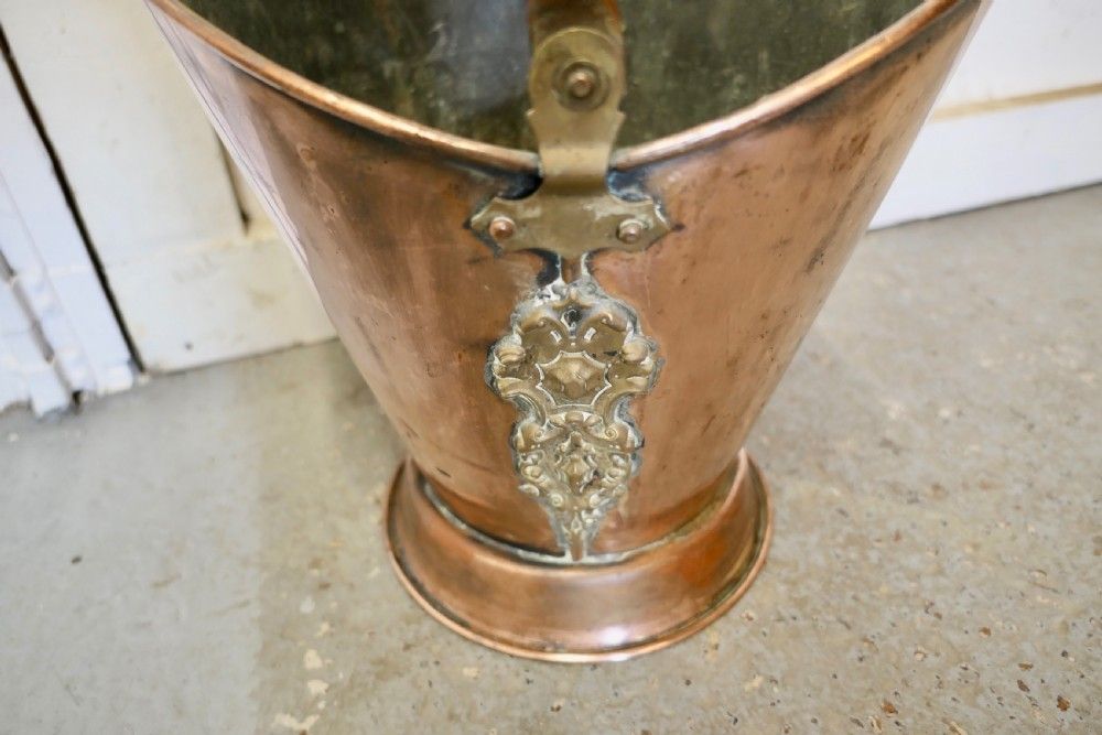 An Art Nouveau Embossed Copper Helmet Coal Scuttle photo buy