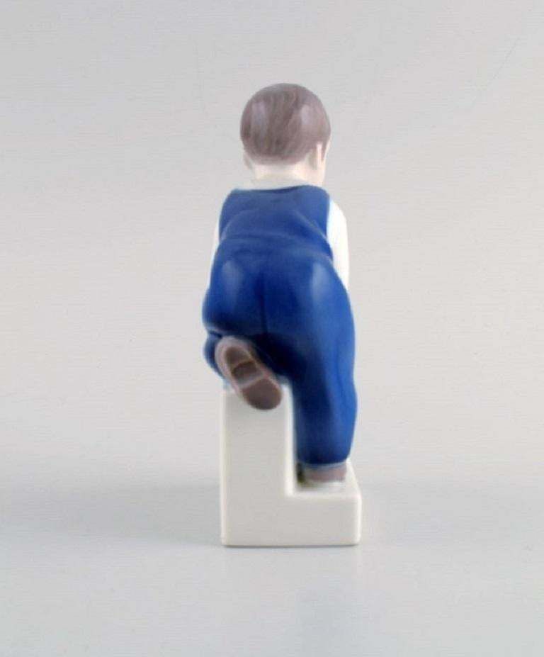 Claire Weiss For Bing & Grøndahl. Porcelain Figure. Boy. 1970s photo for sale