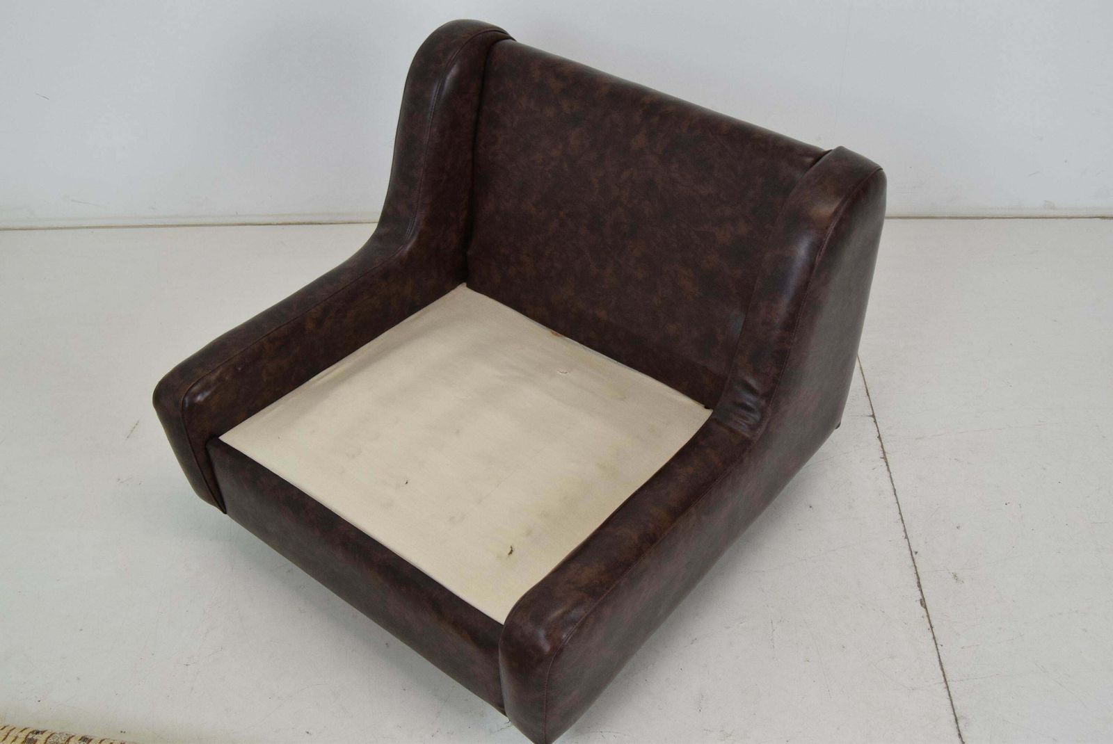 photo vintage Mid Century Leatherette Armchair On The Wheels,1970's.
