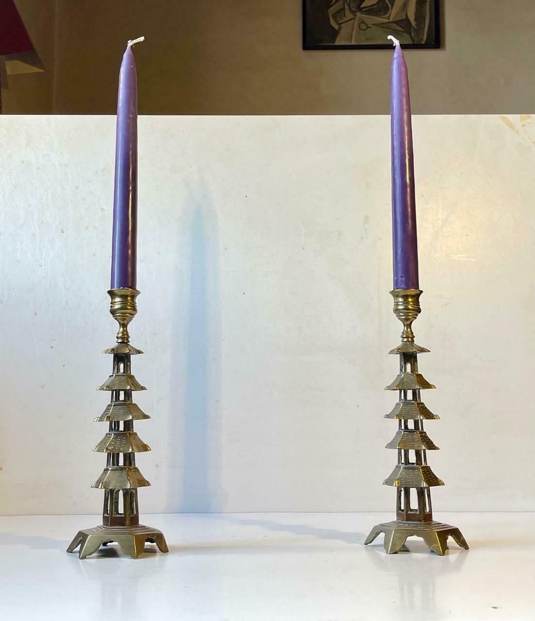 Pair Of Old Chinese Pagoda Candlesticks In Brass photo for sale