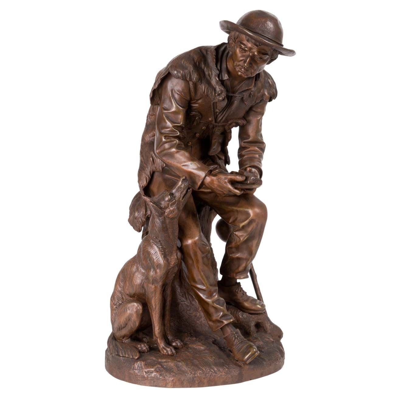 Anatole J. Guillot Bronze Sculpture Depicting "Seated Woodcarver With Dog