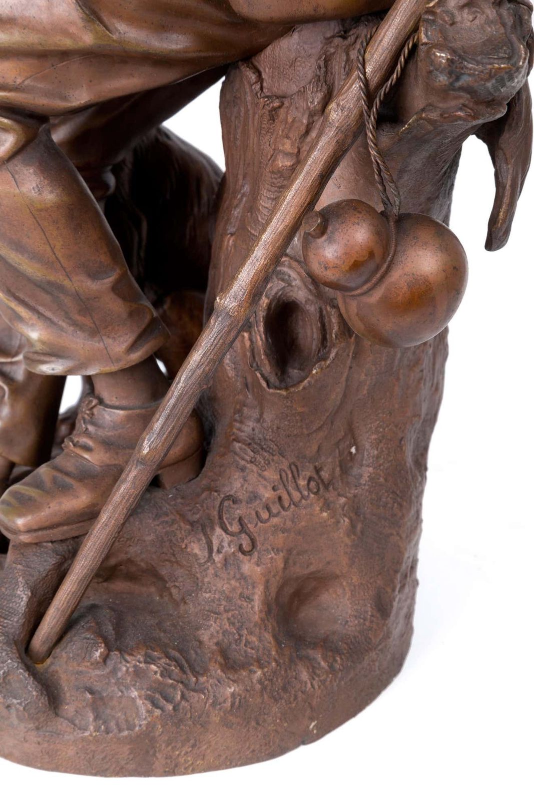 Anatole J. Guillot Bronze Sculpture Depicting "Seated Woodcarver With Dog photo buy