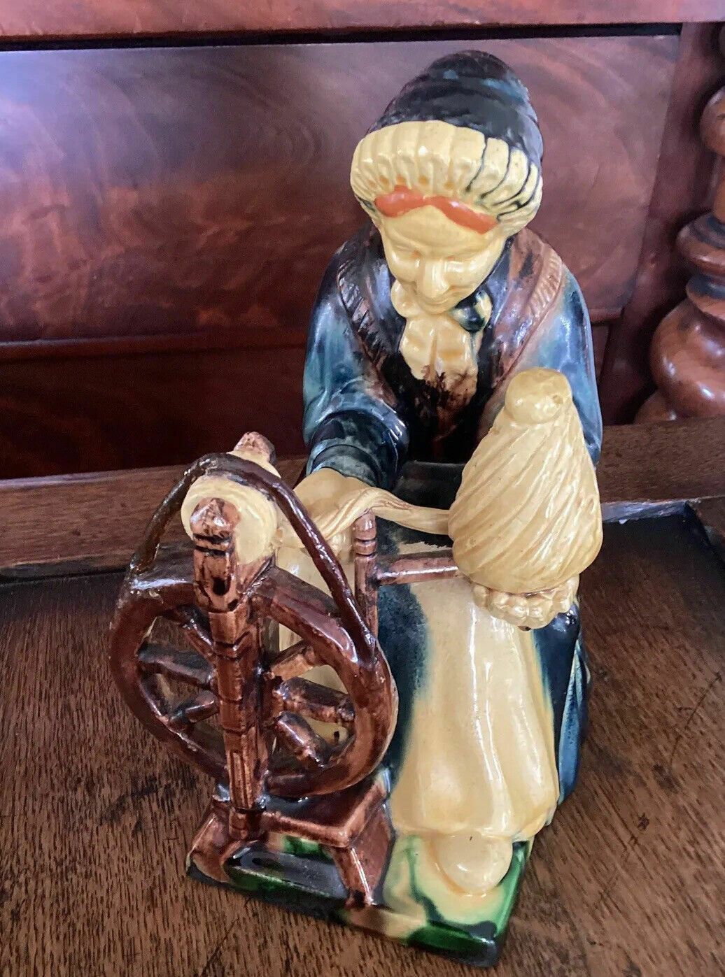 Early 20th C Continental Bisque Pottery Figurine. Dutch Woman Spinning Yarn photo for sale