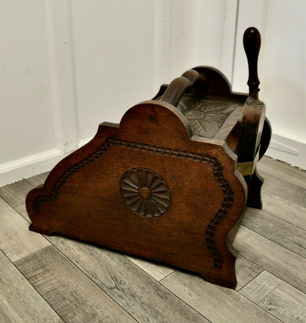 A Carved Arts And Crafts Oak Coal Box With Liner And Shovel photo for sale