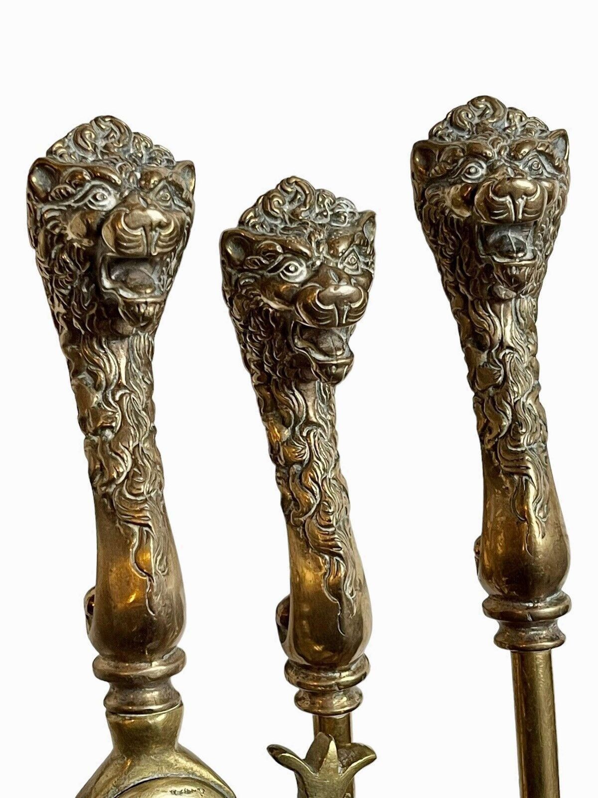 A Set Of Brass Lion Head Fire Irons photo vinterior