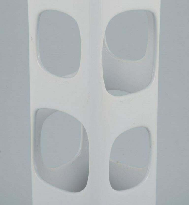European Studio Ceramicist. Unique Vase With Holes In White Glaze photo Home Decor