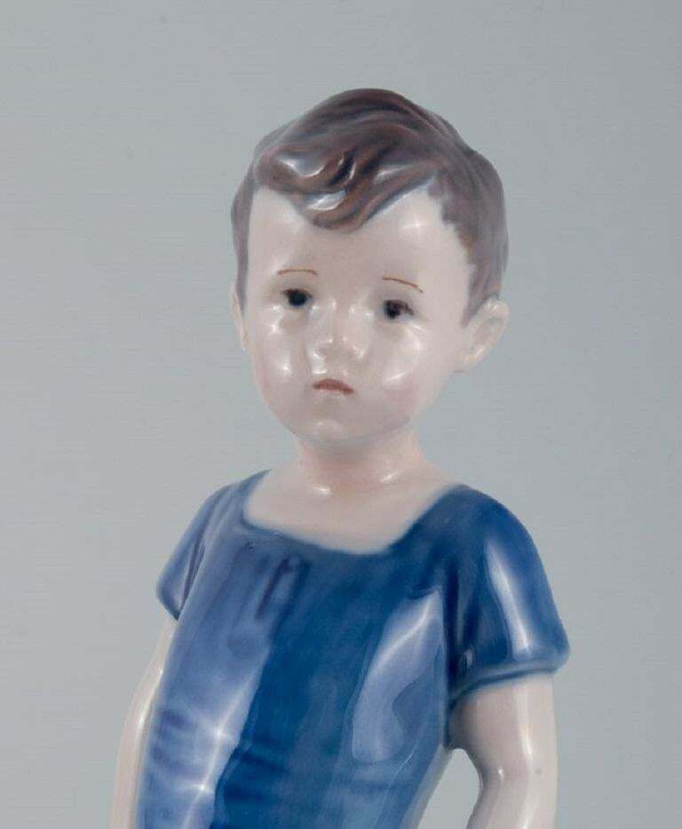 Royal Copenhagen, A Rare Figure Of A Boy. Model Number 519. photo for sale
