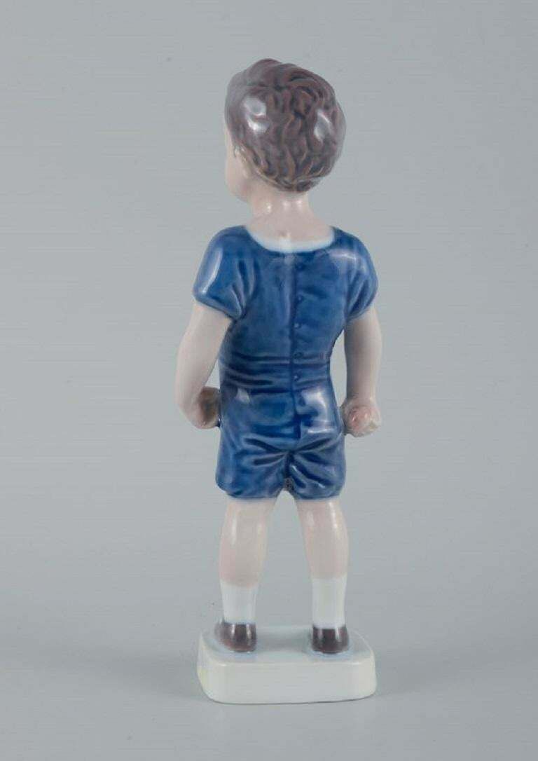 Royal Copenhagen, A Rare Figure Of A Boy. Model Number 519. photo 341.0