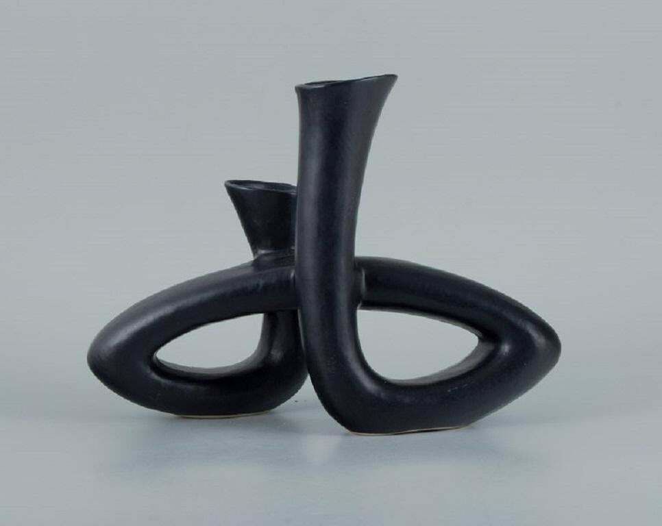 European Studio Ceramicist. Unique Twisted Vase In Black Glaze. Late 1900s. photo furniture