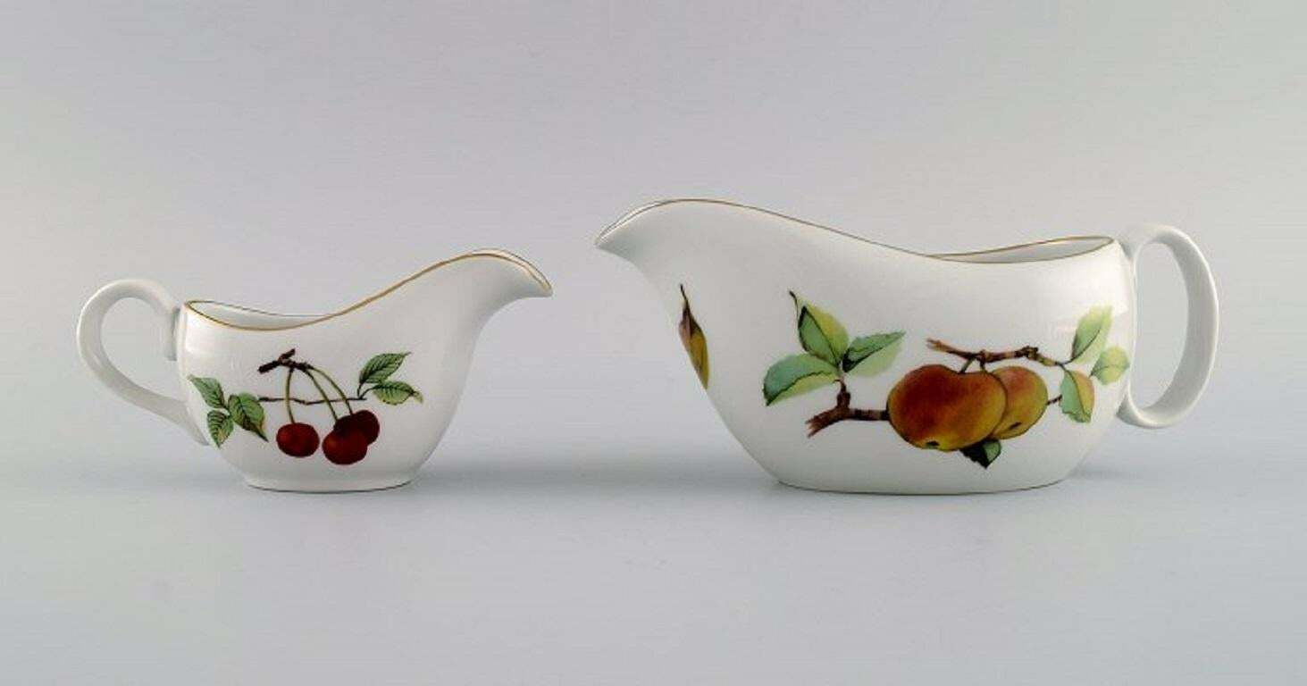 Royal Worcester, England. Two Evesham Sauce Jugs With Saucers In Porcelain. photo for sale
