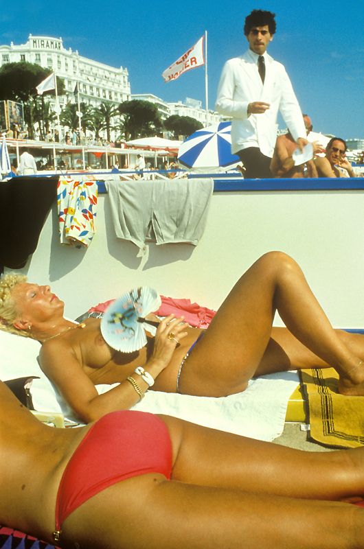 'Sunbathing At Cannes' Homer Sykes Framed In Black photo furniture