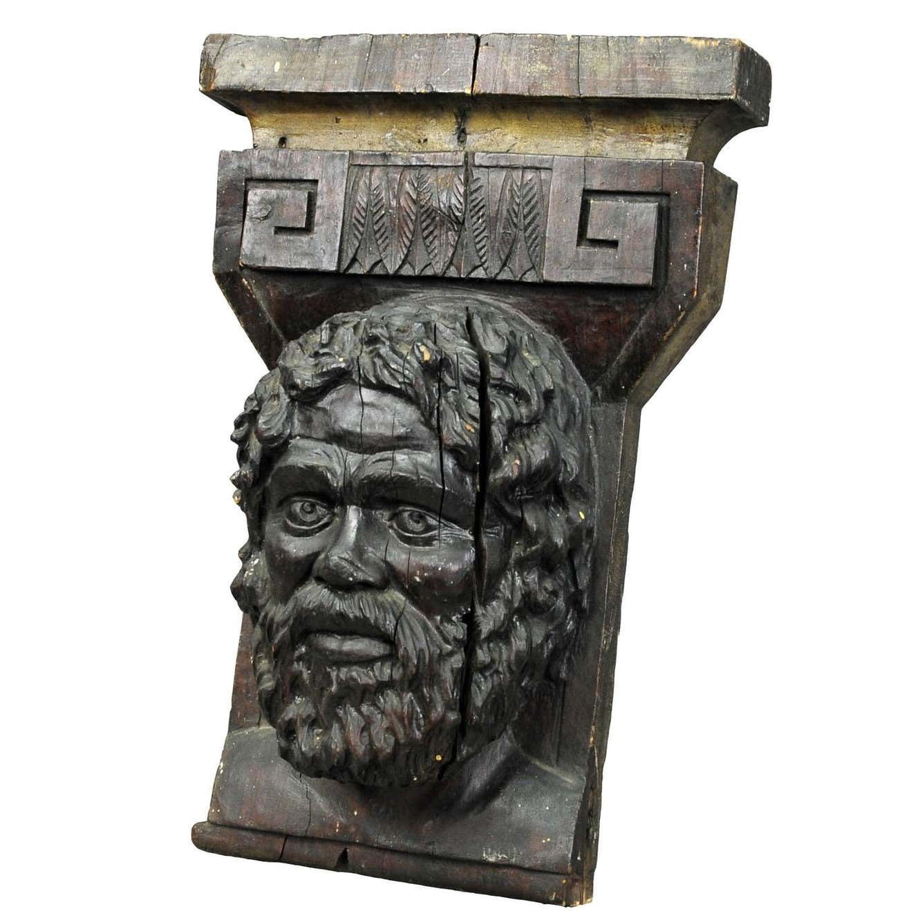 Wooden Sculpture Of A Masculine Face photo furniture