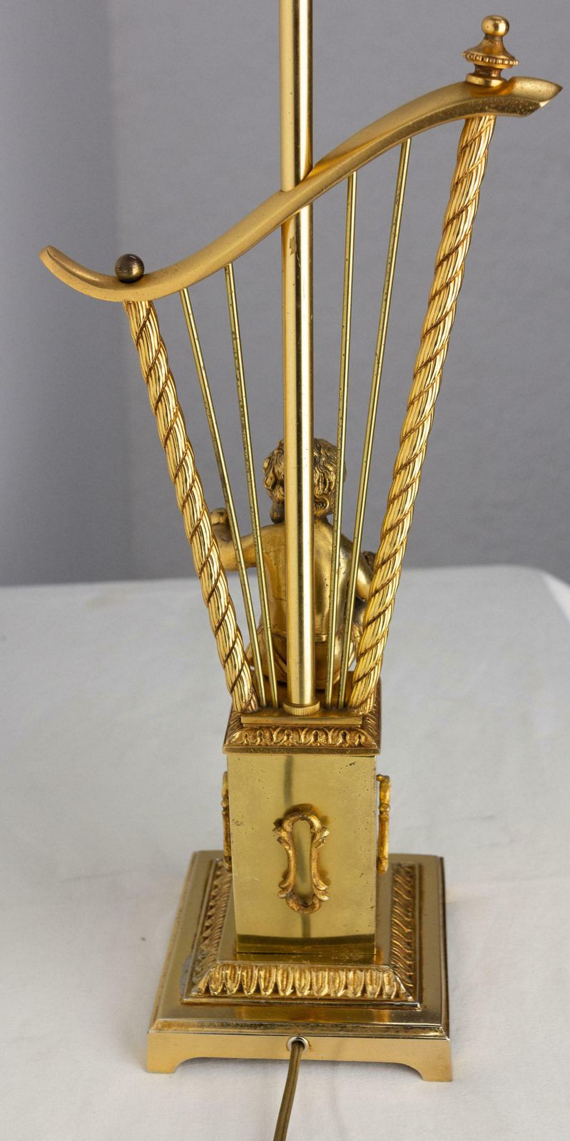 photo for sale French Brass Table Lamp With Putti Reading In Front Of A Harp, Mid Century