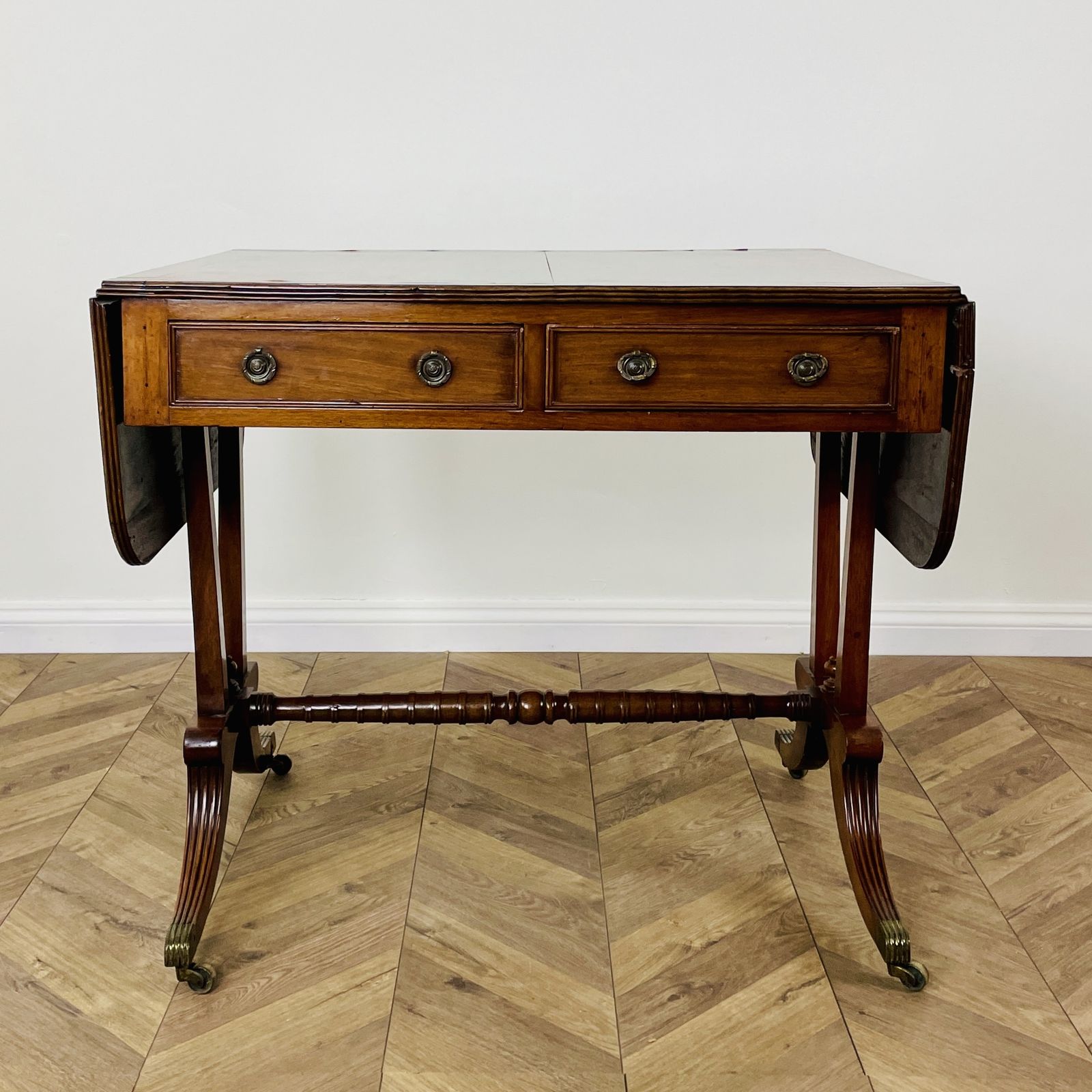 photo buy Antique English Mahogany Drop Leaf Stretcher Table On Castors, 19th Century