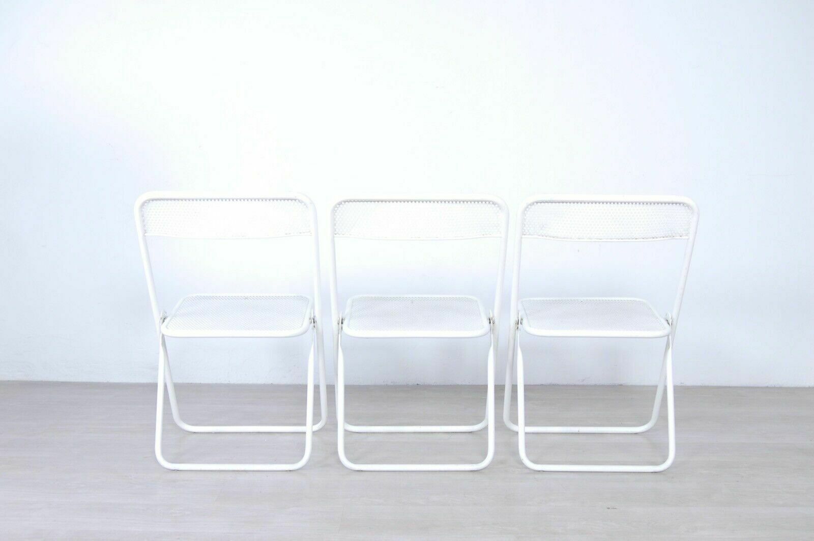 3 Vintage Folding Chairs In Perforated White Enamelled Iron Bar From The 60s And 70s photo vintage