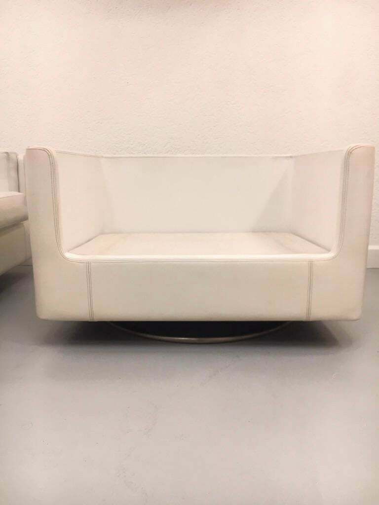 photo furniture Pair Of Swiveling White Faux Leather "Montenapo" Armchairs By Zanotta Italy 1965