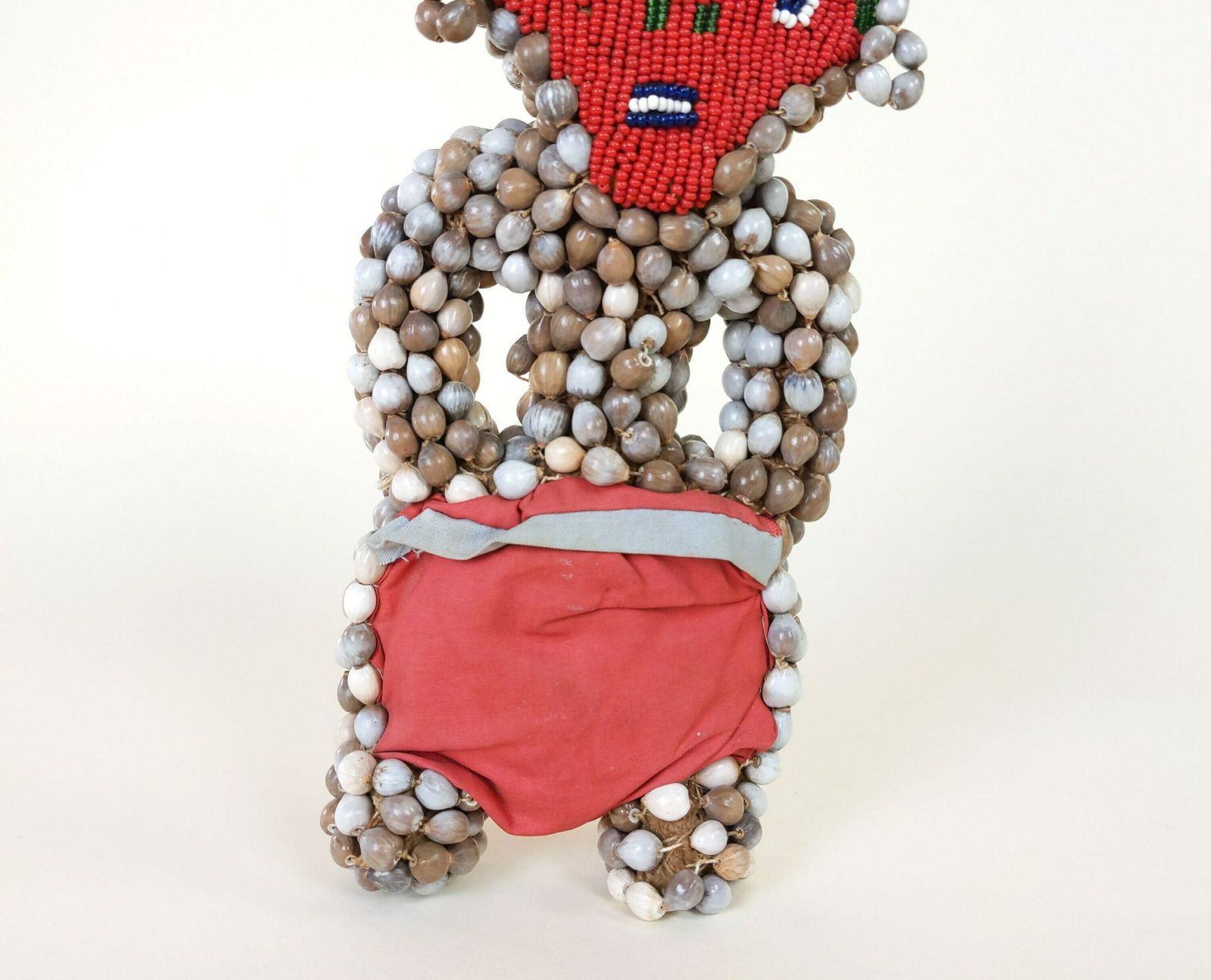 Primitive African Tribal Art Doll With Red Bead Face And Seed Grain Covered Burlap Body photo for sale