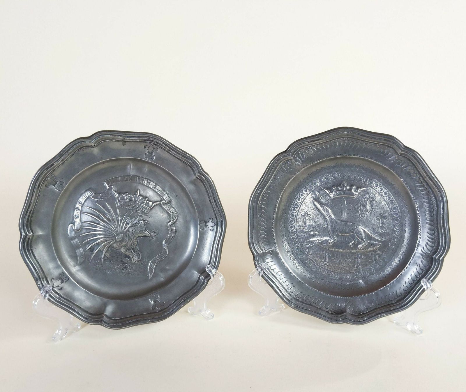 Two Old French Pewter Metal Decorative Dishes With Exotic Animals And Fleur De Lys And Crown Decorations With Makers Mark