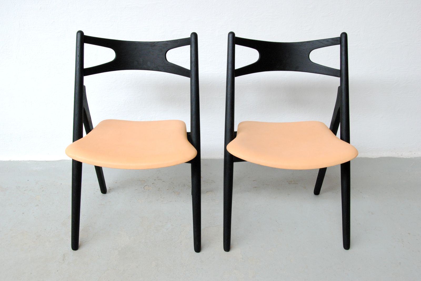 Set Of Two Fully Restored Danish Hans Wegner Sawbuck Chairs In Ebonized Oak 1950's photo for sale