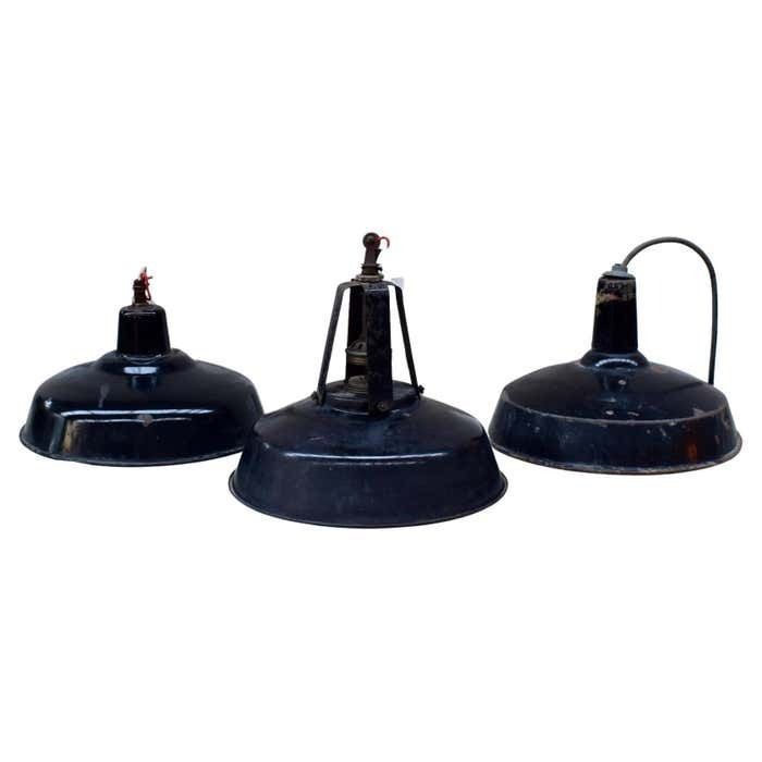 A Set Of Industrial Black Enamel Hanging Lamps Circa 1940s