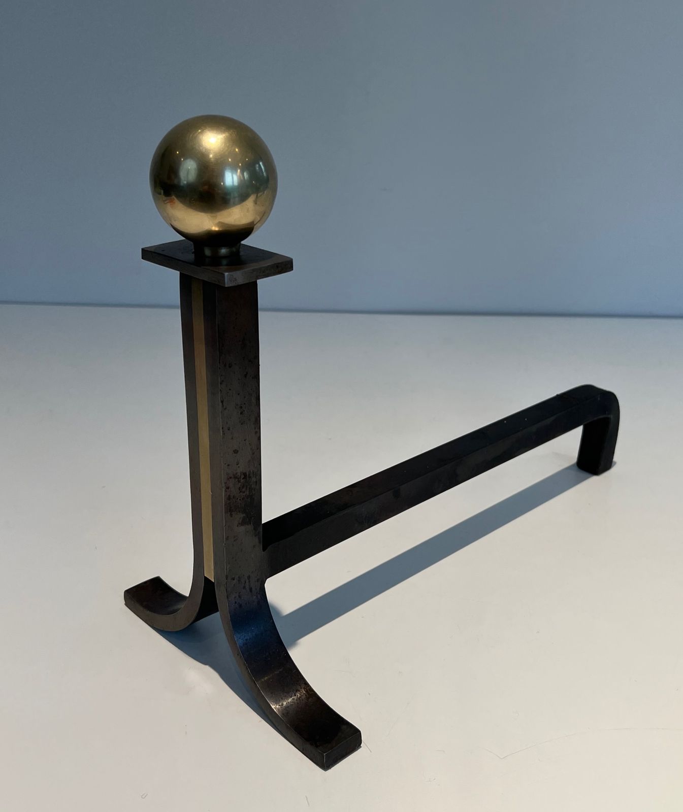 photo buy Pair Of Modernist Andirons In Steel, Brass And Wrought Iron In The Style Of Jacques Adnet