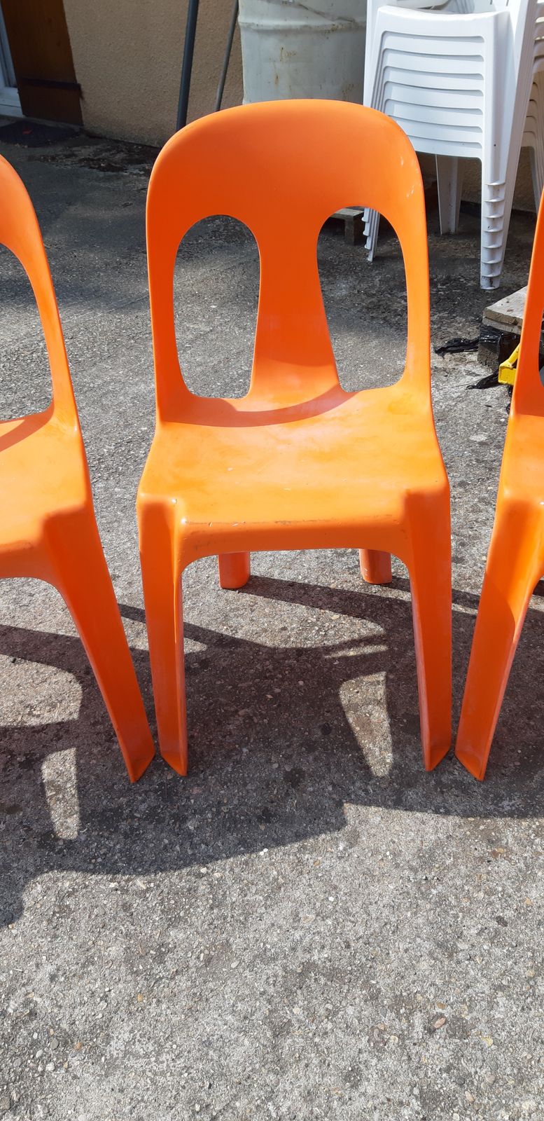 12 Stackable Orange Plastic Chairs photo Furniture