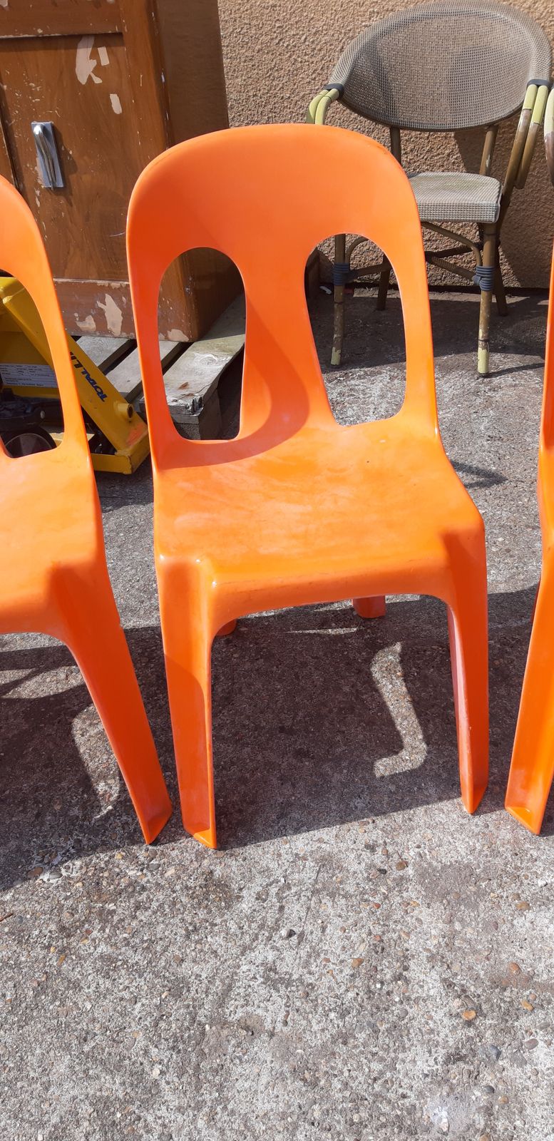 12 Stackable Orange Plastic Chairs photo vinterior