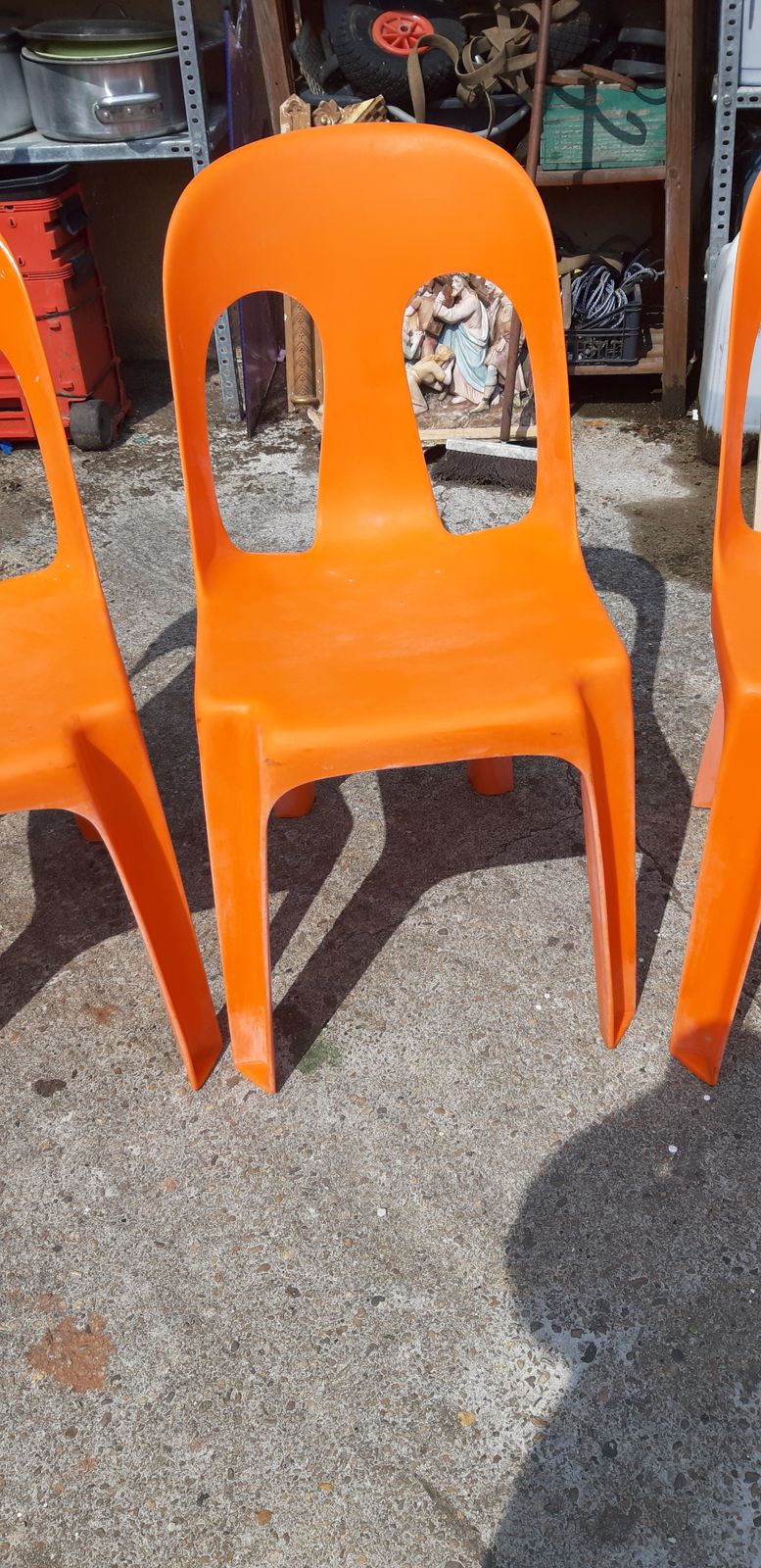 photo for sale 12 Stackable Orange Plastic Chairs