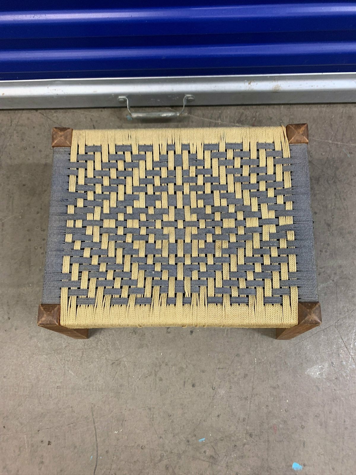 photo furniture Cute Little Footstool With Woven Rope Seat And Slanted Legs