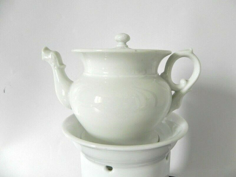 Tea Set For One, White Stoneware Tea Pot, Tea Cup, And Tea Pot And Warmer photo furniture