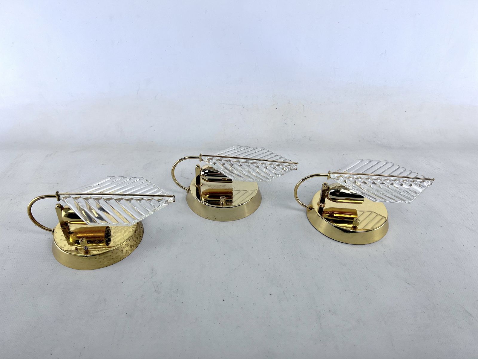 Vintage Set Of Three Sconces In Brass And Glass By Zero Quattro. Italy 1970s photo furniture