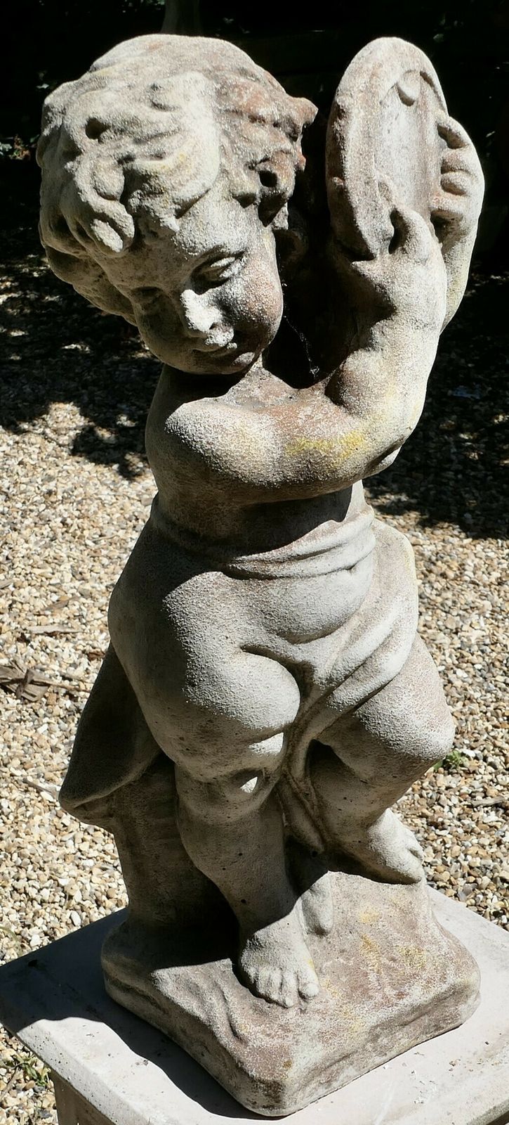 Old Weathered Statue Of A Putti Playing Tambourine photo Garden Decor