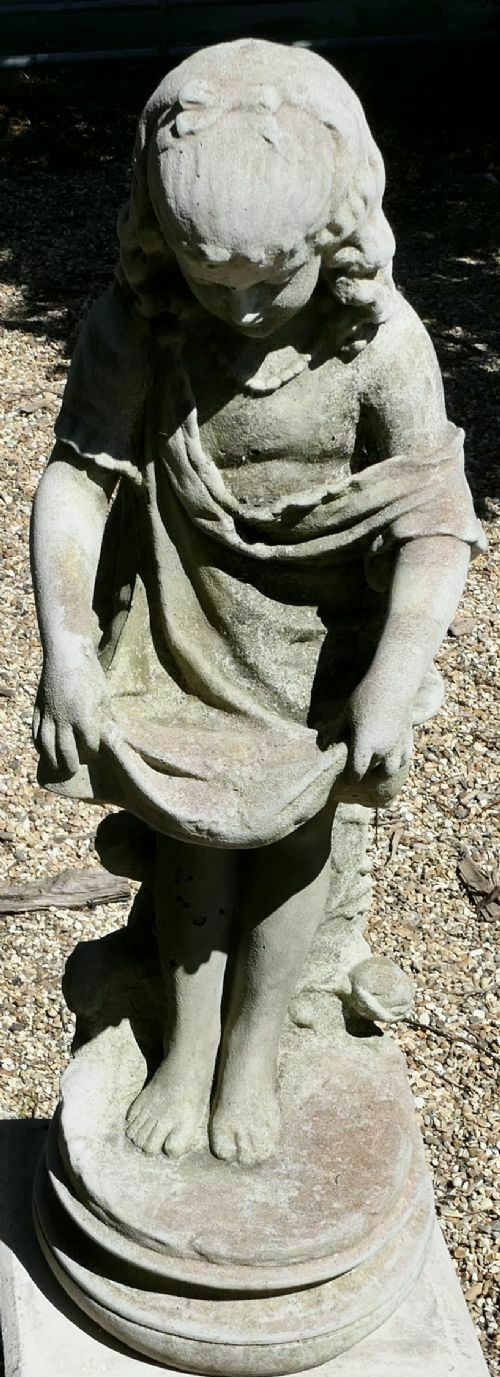 Statue Of A Girl Holding Out Her Apron photo furniture