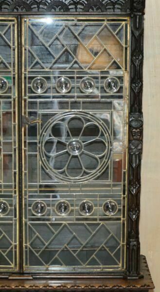 photo furniture Antique Jacobean Linen Fold Carved Zinc Lined Astral Glazed Library Bookcase