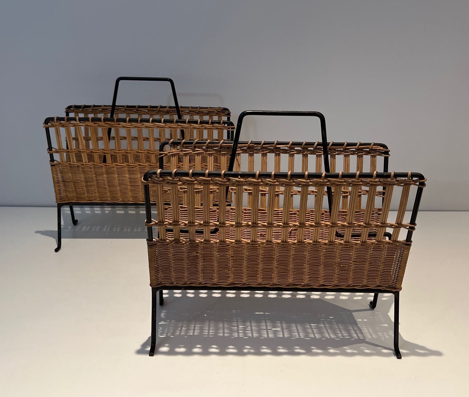 Pair Of Magazine Racks In Black Lacquered Metal And Rattan photo furniture