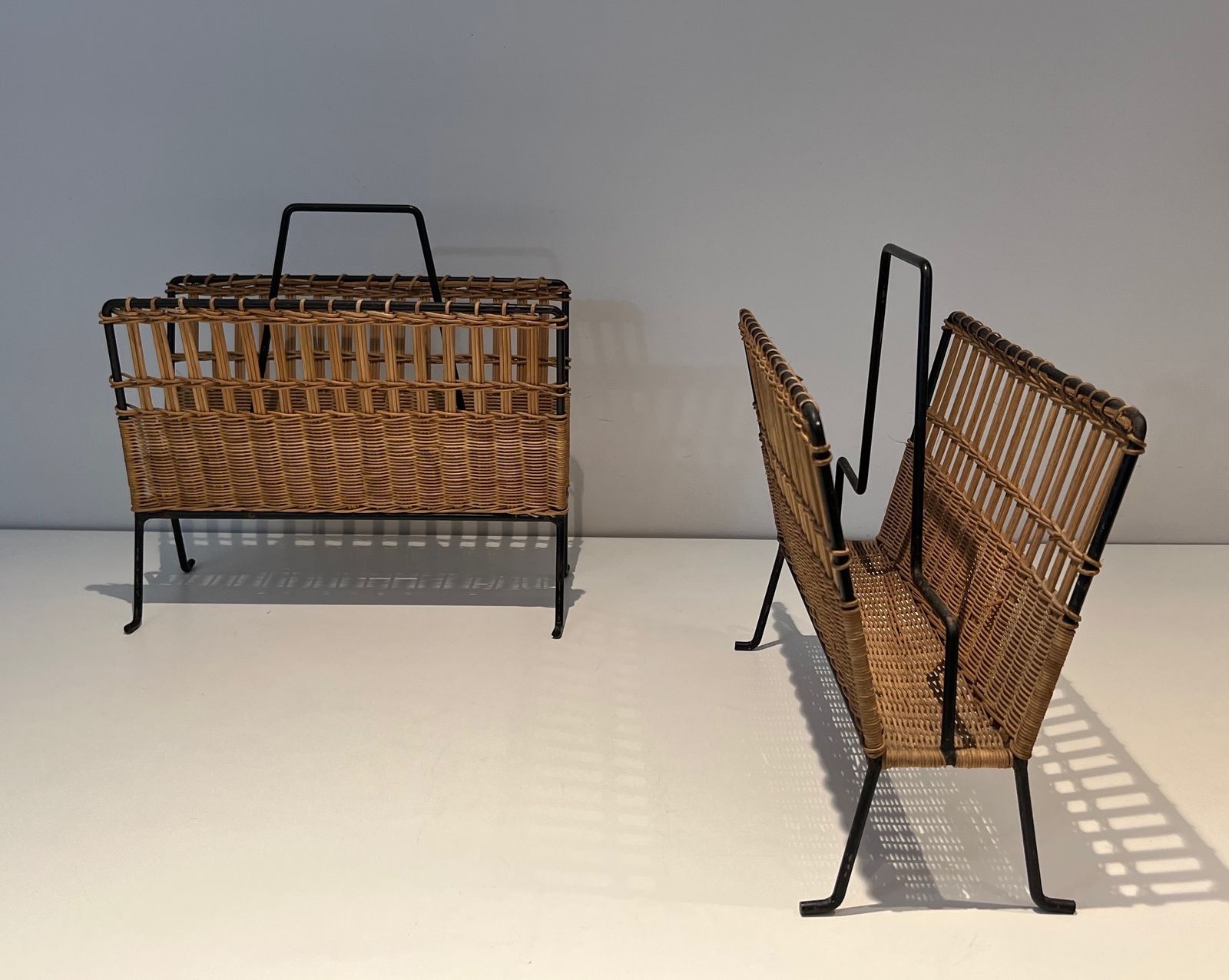 Pair Of Magazine Racks In Black Lacquered Metal And Rattan photo for sale