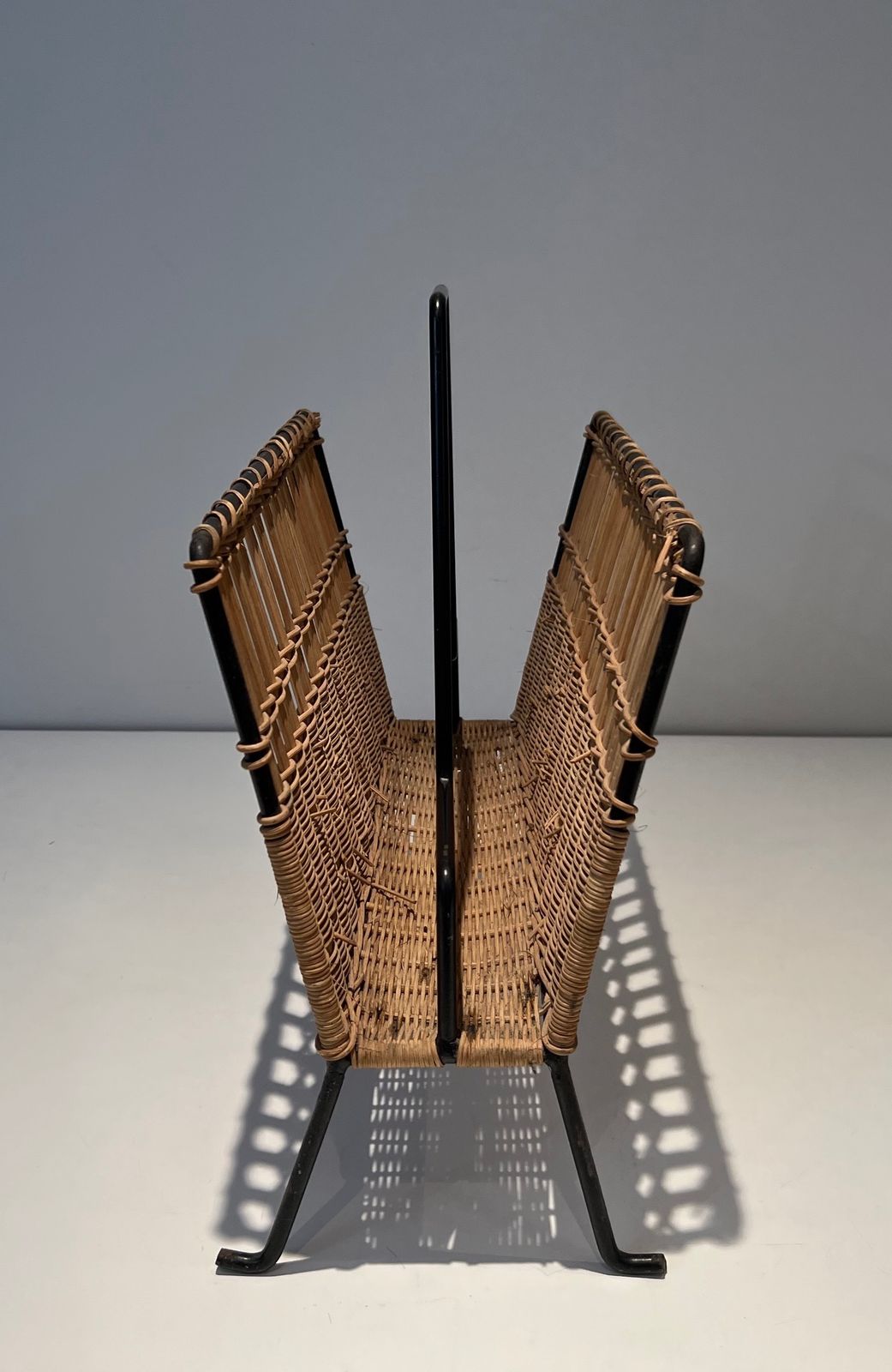 photo furniture Pair Of Magazine Racks In Black Lacquered Metal And Rattan