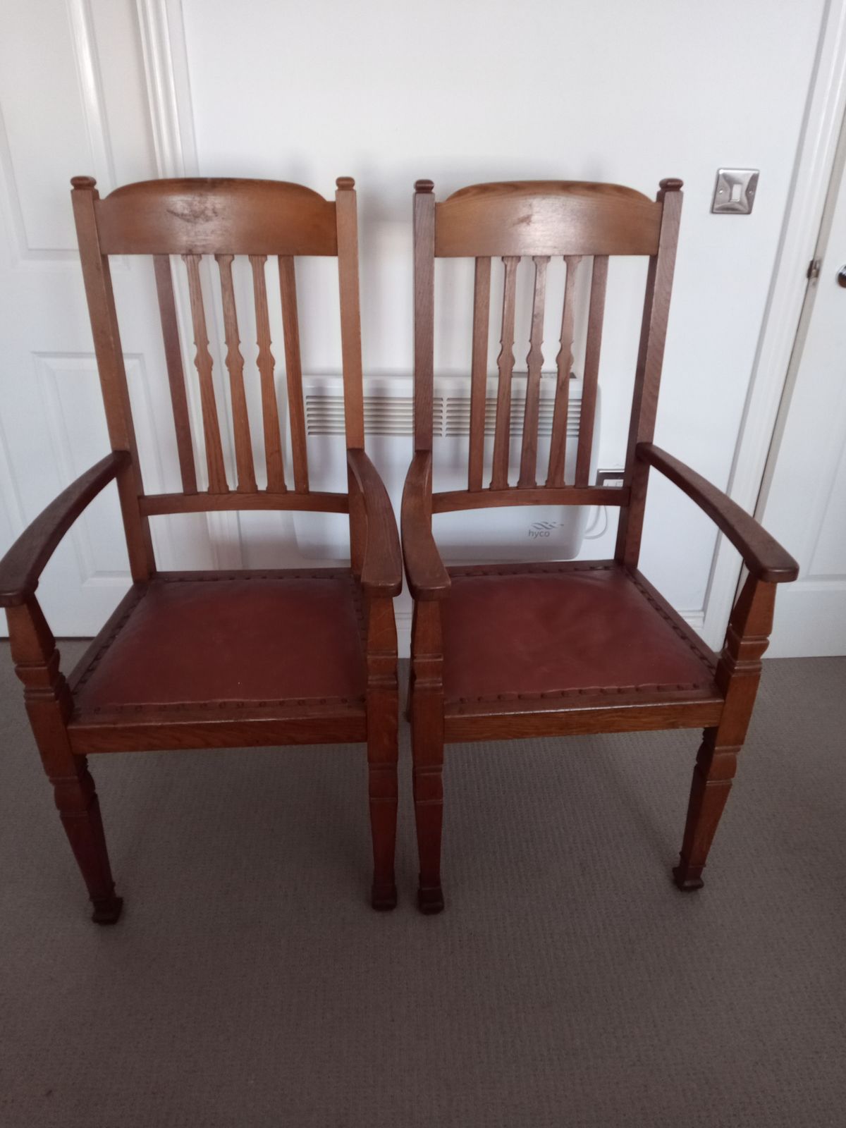 A Pair Of Oak Shapland And Petter Carver Chairs