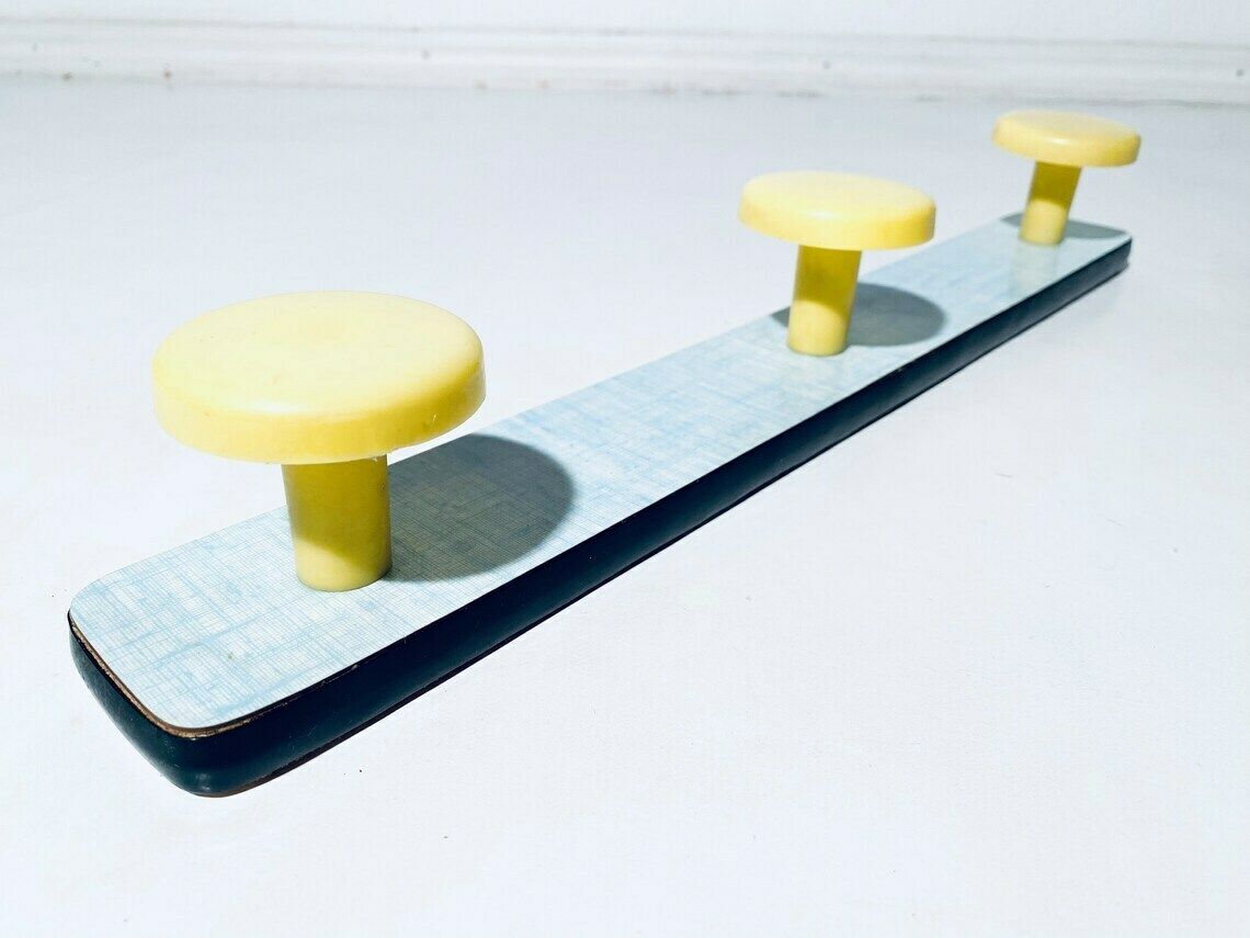 Vintage Pastel Yellow And Green Clothes Rack Hooks  1950s 60s Vintage Interior photo vinterior