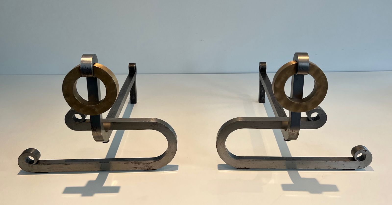 Home Fixtures Pair Of Modernist Andirons In Chromed Steel, Brass And Wrought Iron photo