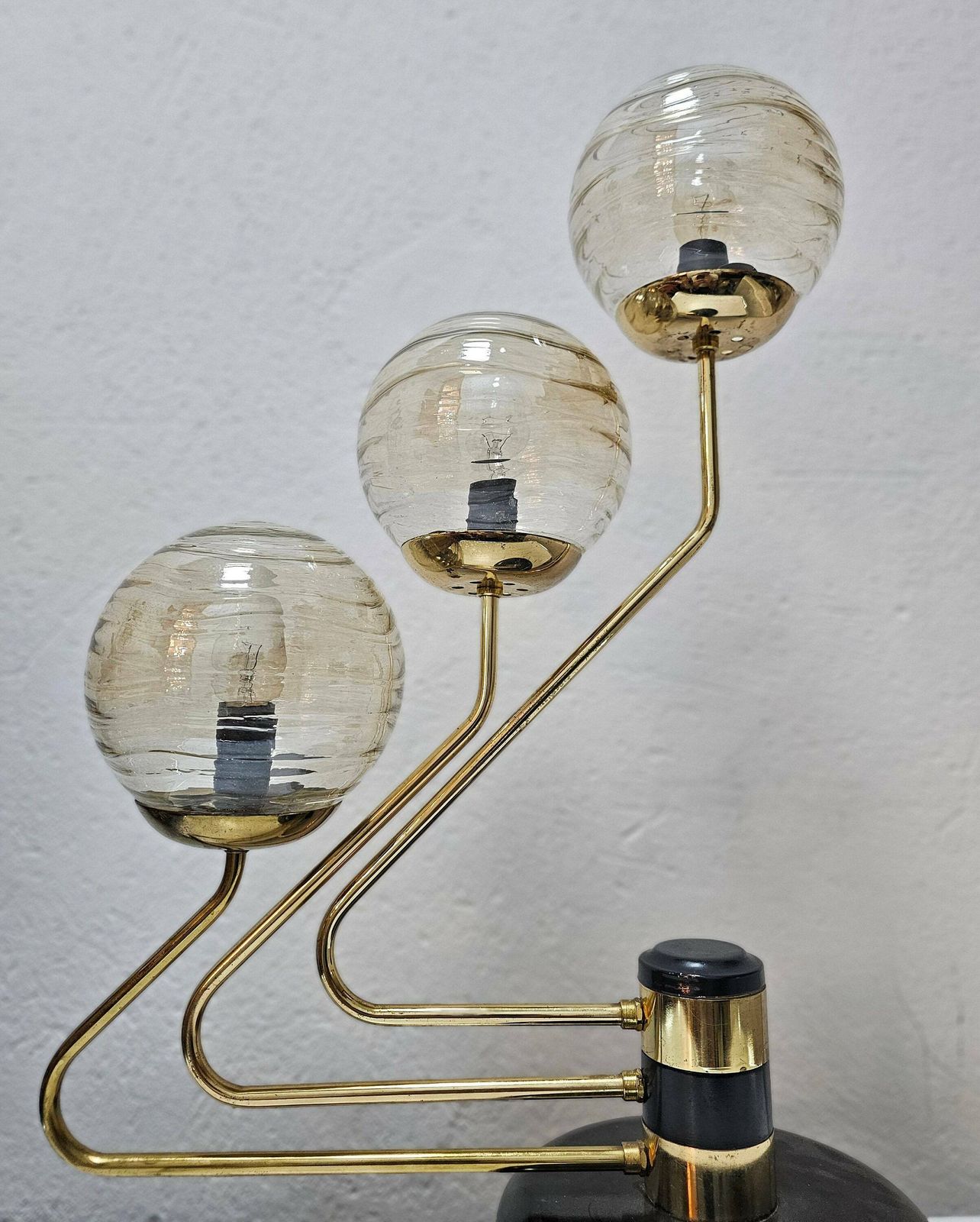 Mid Century Modern 3 Arm Table Lamp In Black And Gold With Texture Glass Ball Shades Made In Yugoslavia In 1960s photo vinterior