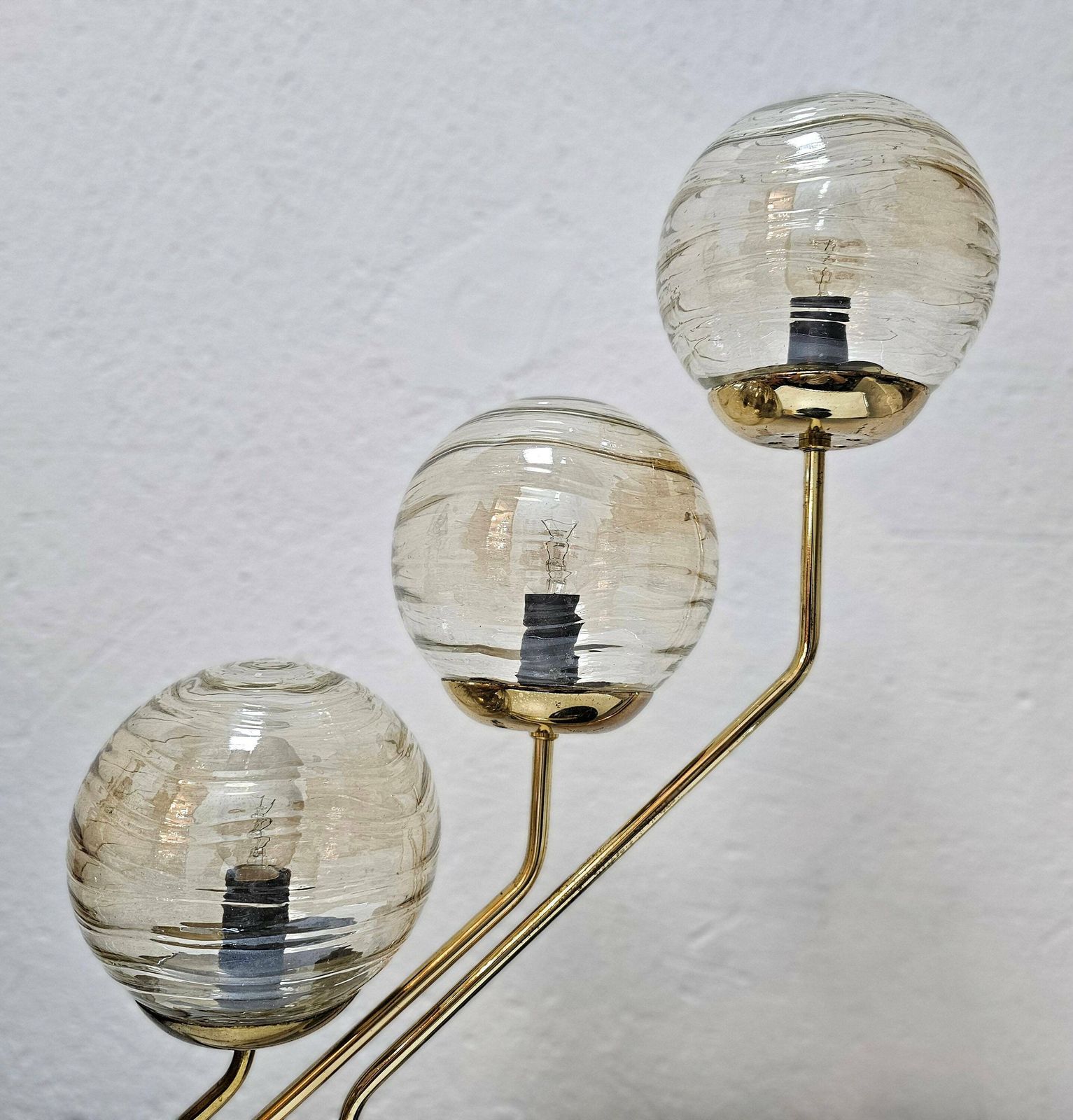 Mid Century Modern 3 Arm Table Lamp In Black And Gold With Texture Glass Ball Shades Made In Yugoslavia In 1960s photo vintage