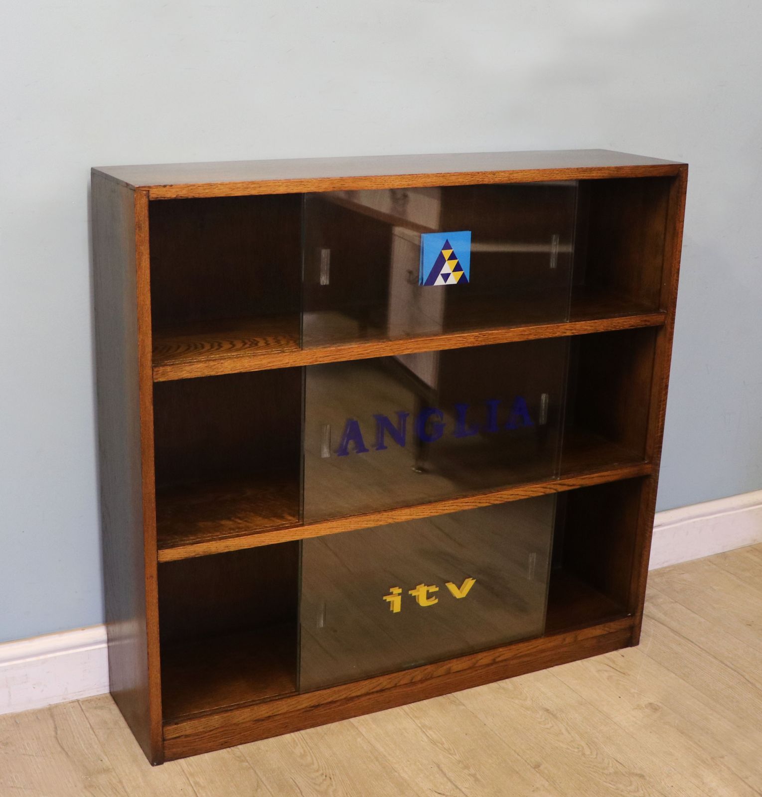 A Lovely Retro Mid Century Display Cabinet Later Sign Written For Anglia Television. photo for sale