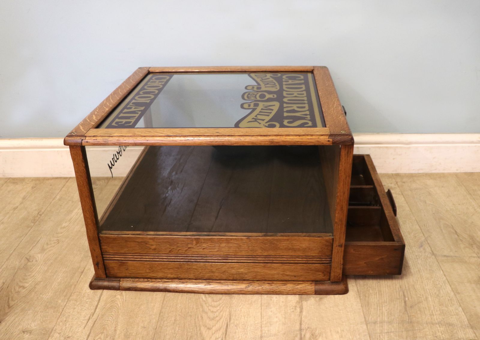 A Lovely Early 20th Century Oak Countertop Display Cabinet, Later Sign Written For Cadburys Chocolate. photo buy